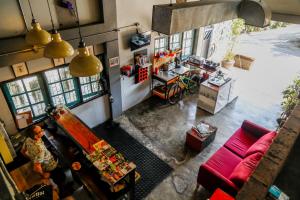 an overhead view of a shop with a red couch at Sleep Guesthouse in Chiang Mai