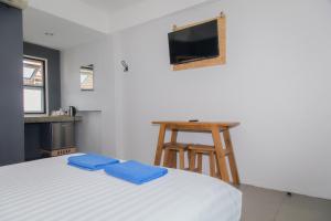 TV a/nebo společenská místnost v ubytování Sleep Guesthouse