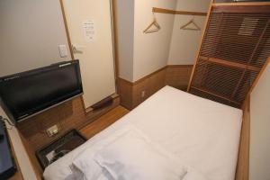 Postel nebo postele na pokoji v ubytování プチホテル　コスモス