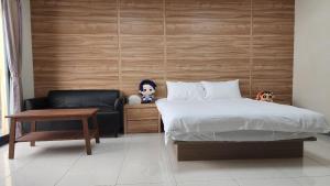 Una cama o camas en una habitación de 宜家莊親子民宿