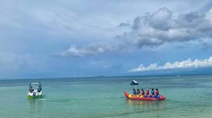 a group of people riding on tubes in the water at Tropical Fun Ta Sea Rentals in Siquijor