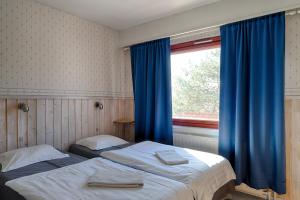מיטה או מיטות בחדר ב-Guesthouse Borealis