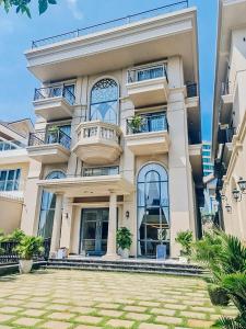 a large building with balconies on it at Sabina Luxury Boutique Hotel & Villa in Vung Tau