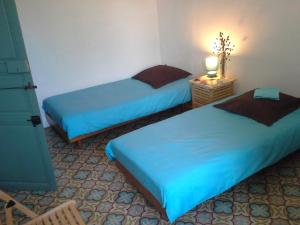 Säng eller sängar i ett rum på Villa Fontilha
