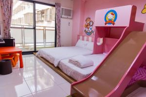 Una cama o camas en una habitación de 宜家莊親子民宿