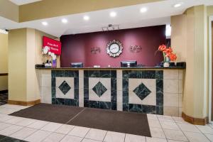 a lobby of a hotel with a counter at Red Roof Inn South Bend - Mishawaka in South Bend