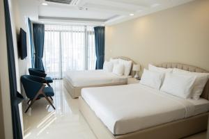 Posteľ alebo postele v izbe v ubytovaní Ruby Hotel