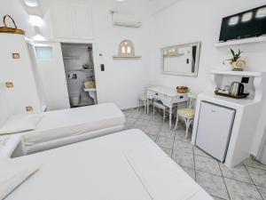 Postel nebo postele na pokoji v ubytování Anoi Rooms