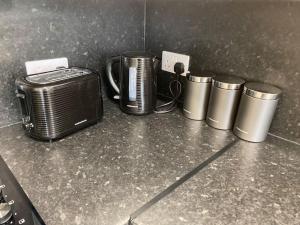 a group of appliances sitting on top of a counter at The Burrow, Langholm, Dumfries and Galloway in Langholm