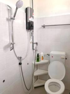 a bathroom with a shower with a toilet in it at Blue House｜Ulu Yam Homestay｜12-15pax in Batang Kali