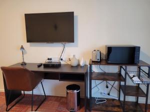 TV a/nebo společenská místnost v ubytování City of Sails Motel