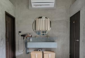 a bathroom with a sink and a mirror at Slack BnB in Xiaoliuqiu +40 photos
