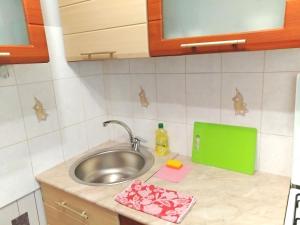 a kitchen counter with a sink and a metal sink at 429. Отличный вариант для туриста и командированного in Almaty