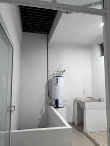 a room with a water heater on the wall at TWO bedroom apartment 101 in Mazatlán
