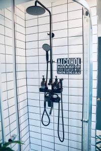 a shower with two shelves on the wall at Modern Penthouse Apartment in Cobh Town in Cobh