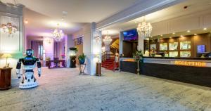 a lobby of a hotel with a robot in the middle at Alpin Resort Hotel in Poiana Brasov