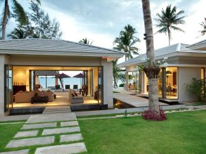 a home with a patio with a view of the ocean at Inasia Beach Villa by Elite Havens in Lipa Noi