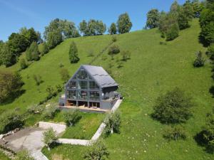 an aerial view of a house on a hill at On Top Chalet in Bran