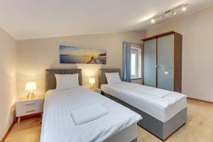 Posteľ alebo postele v izbe v ubytovaní Apartament George
