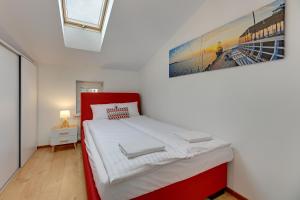 Posteľ alebo postele v izbe v ubytovaní Apartament George