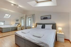 Posteľ alebo postele v izbe v ubytovaní Apartament George