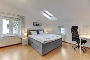 Posteľ alebo postele v izbe v ubytovaní Apartament George