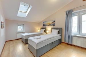 Posteľ alebo postele v izbe v ubytovaní Apartament George + 18 fotografií