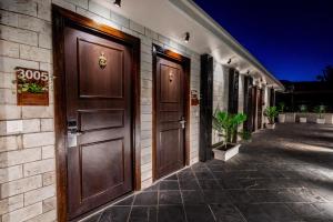 a row of doors on the side of a building at Sterling Legacy Shimla in Shimla