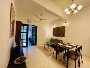 a living room with a table and a couch at The Hill Regency in Bentong +12 photos