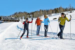 a group of people on skis in the snow at Apartment, Huttau in Hüttau