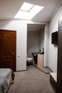 TV a/nebo společenská místnost v ubytování Optima Collection Park Hotel Ivano-Frankivsk