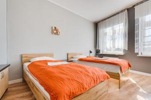 Posteľ alebo postele v izbe v ubytovaní Hotel Sowa