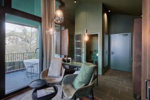 Area soggiorno di Floris Green Suites by Parc Hotel Florian