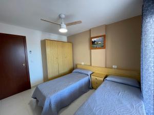 A bed or beds in a room at Alpen1 Europeñiscola