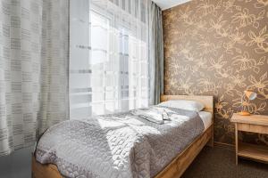 Posteľ alebo postele v izbe v ubytovaní Hotel Sowa