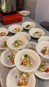 a bunch of plates of food on a table at Unisi Hotel Malioboro - Jogja Syariah in Yogyakarta