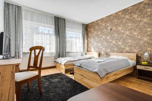Posteľ alebo postele v izbe v ubytovaní Hotel Sowa