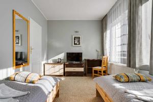Posteľ alebo postele v izbe v ubytovaní Hotel Sowa