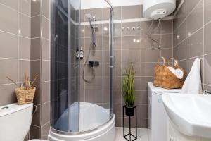 Kúpeľňa v ubytovaní WOW Apartment by Cozyplace