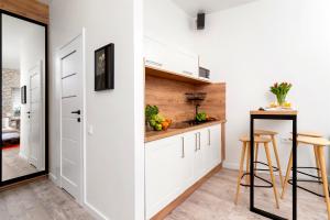 Kuchyňa alebo kuchynka v ubytovaní WOW Apartment by Cozyplace