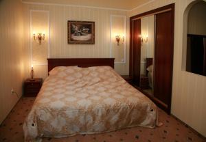 Postel nebo postele na pokoji v ubytování Optima Collection Park Hotel Ivano-Frankivsk