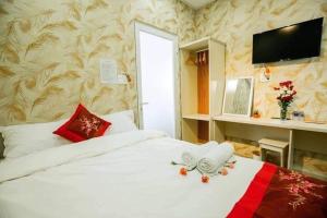 Postel nebo postele na pokoji v ubytování HOTEL NẮNG CHIỀU ĐÀ LẠT