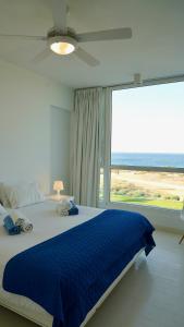 a bedroom with a large bed with a large window at Narcissus 18 in Paralimni +36 photos