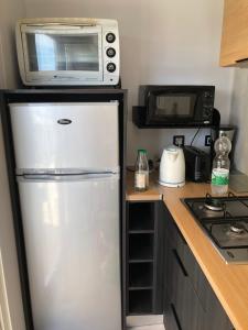 A kitchen or kitchenette at Camping le Castellas