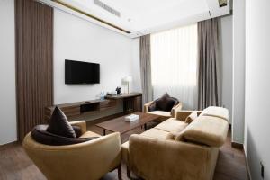 Телевизор и/или развлекательный центр в AKASIYA HOTEL