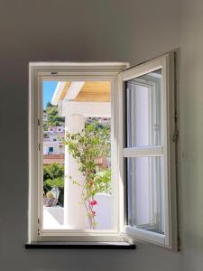an open window with a view of a balcony at Agata B&B in Lipari
