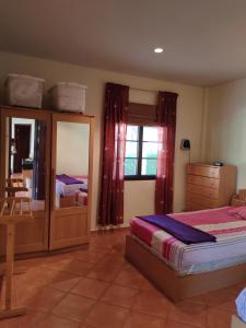 a bedroom with a bed and a dresser and a mirror at Seabreeze 145 by malai in Rayong +81 photos