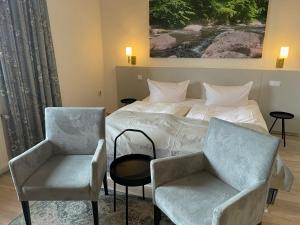 Postel nebo postele na pokoji v ubytování Harzhotel Warnstedter Krug