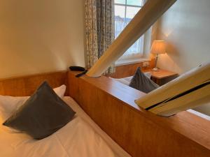 Postel nebo postele na pokoji v ubytování Harzhotel Warnstedter Krug