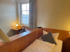 Postel nebo postele na pokoji v ubytování Harzhotel Warnstedter Krug